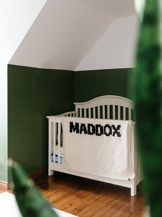 Cream blanket with Black lettering